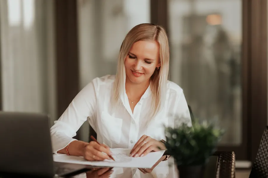 business woman smiling working at home